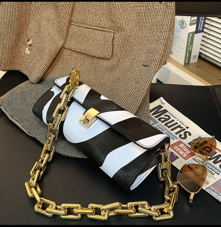 Soft Voluminous Clutch With Square Ring Chain Shoulder