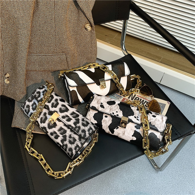 Soft Voluminous Clutch With Square Ring Chain Shoulder