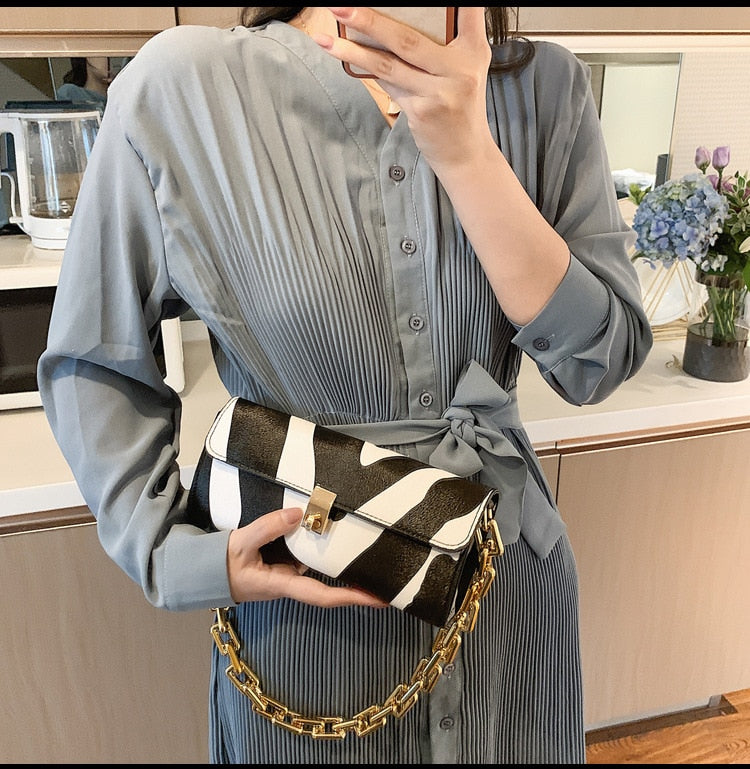 Soft Voluminous Clutch With Square Ring Chain Shoulder